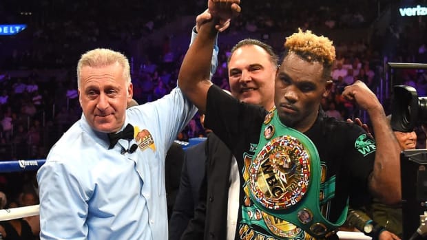 A referee holds the arm of Jermell Charlo after he defeated Austin Trout in their WBC Super Welterweight Title bout at Staples Center in 2018 in LA, California. Houston’s Charlo looks to earn undisputed status in a second weight class with a career-defining triumph over Canelo. JAYNE KAMIN-ONCEA/GETTY IMAGES.